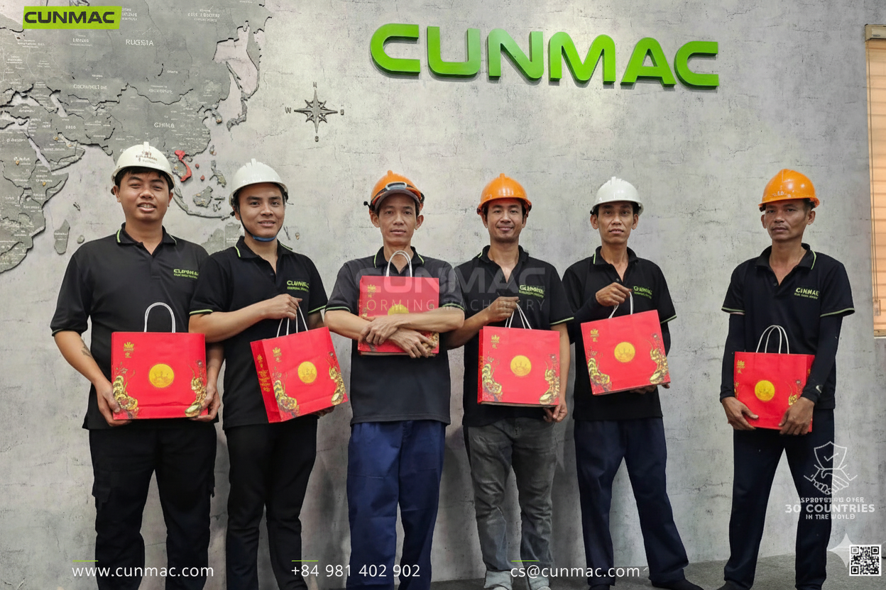 CUNMAC workers proudly displaying Mid-Autumn Festival mooncake gifts from the company